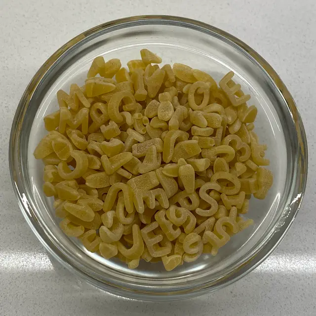 Alphabet in a small round white glass bowl