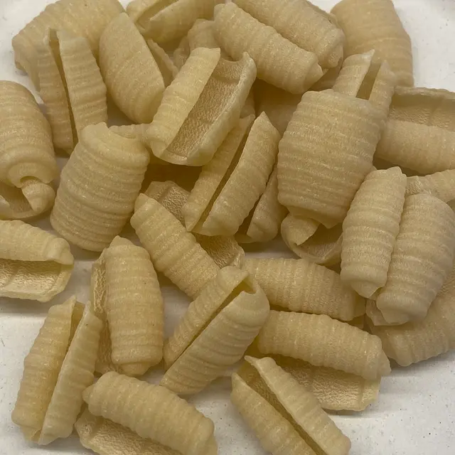 A close up shot of Barilotti on a round white plate