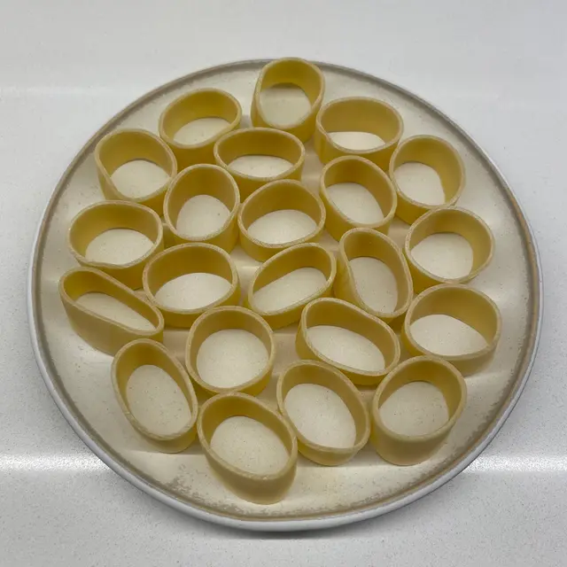 Calamarata on a round white plate