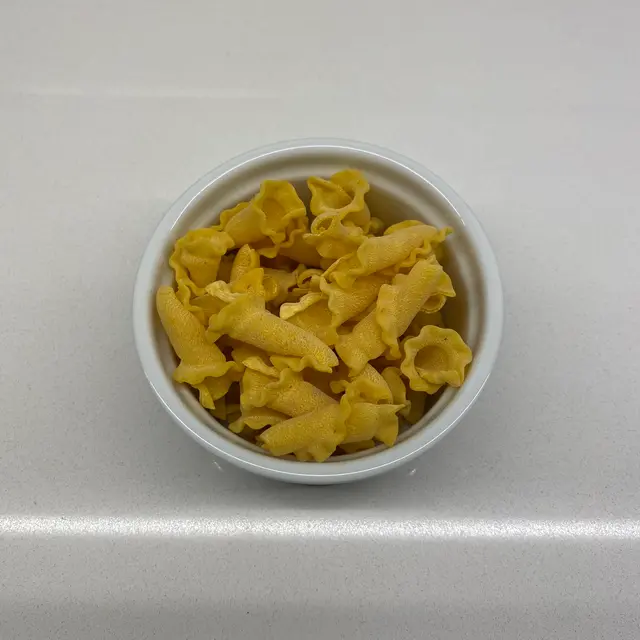 Campanelle in a round white ramekin