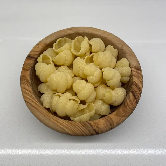 Cestini in a round wooden bowl