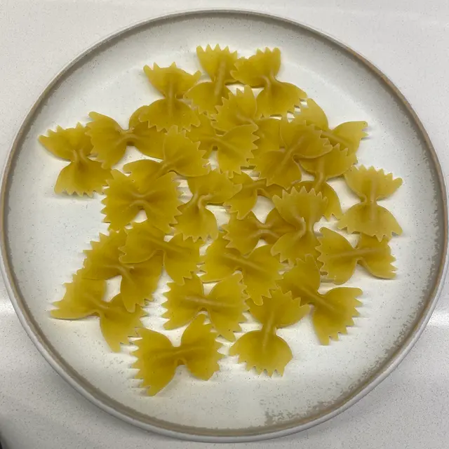 Farfalle on a round white plate