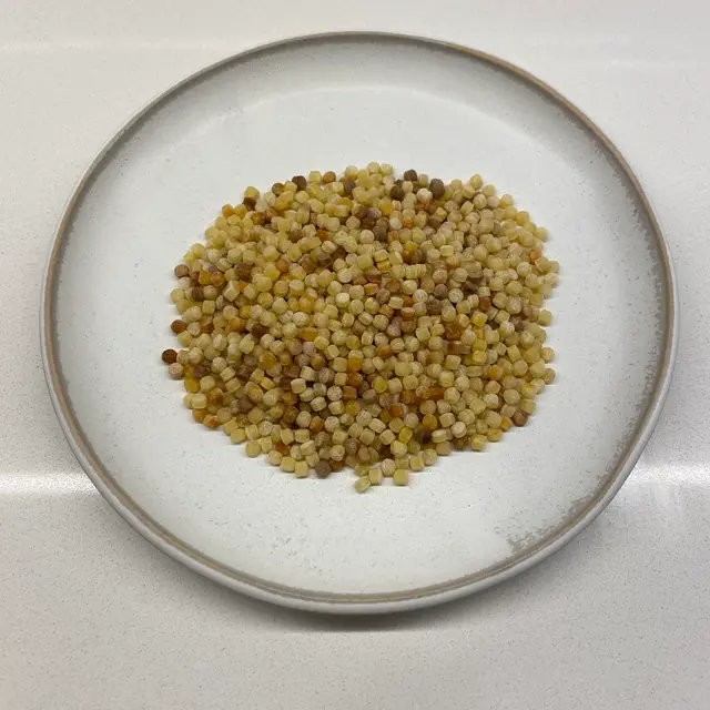 Fregola on a round white plate