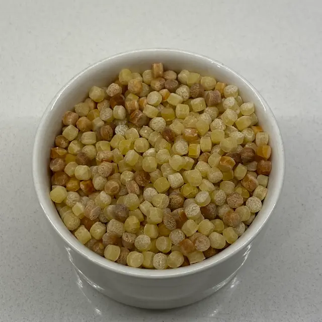 Fregola in a small white bowl