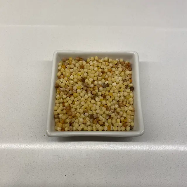 Fregola in a square white glass bowl