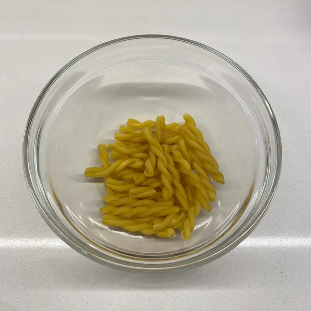 Gemelli in a clear round glass bowl