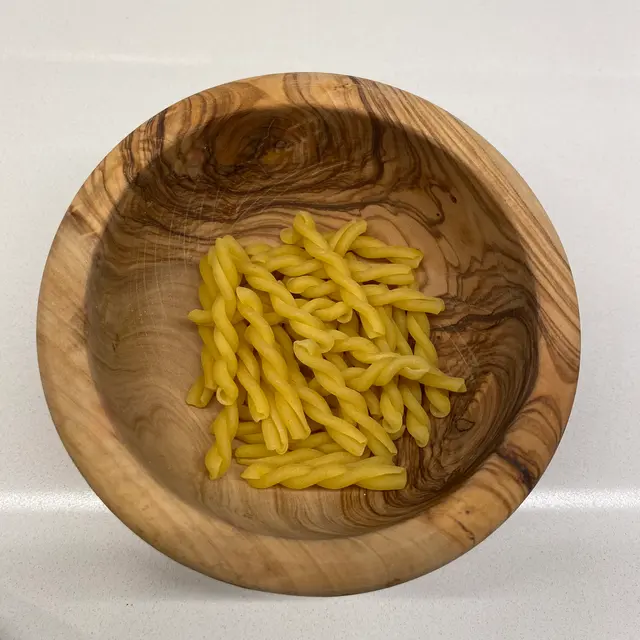 Gemelli in a round wooden bowl