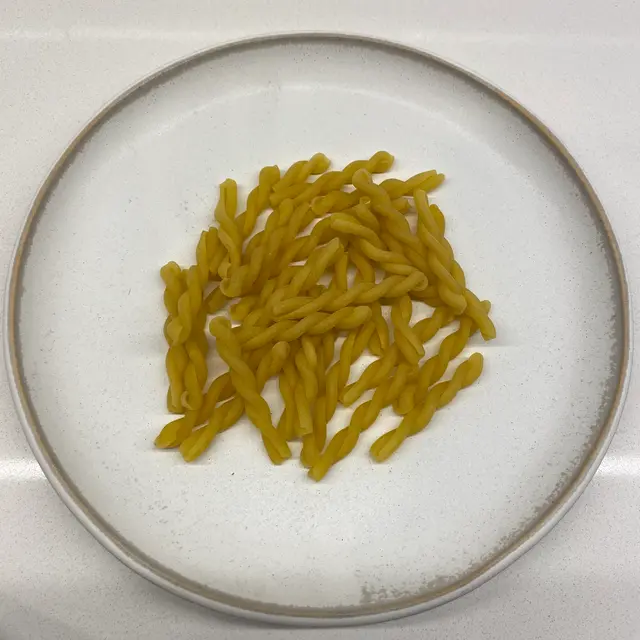 Gemelli on a round white plate