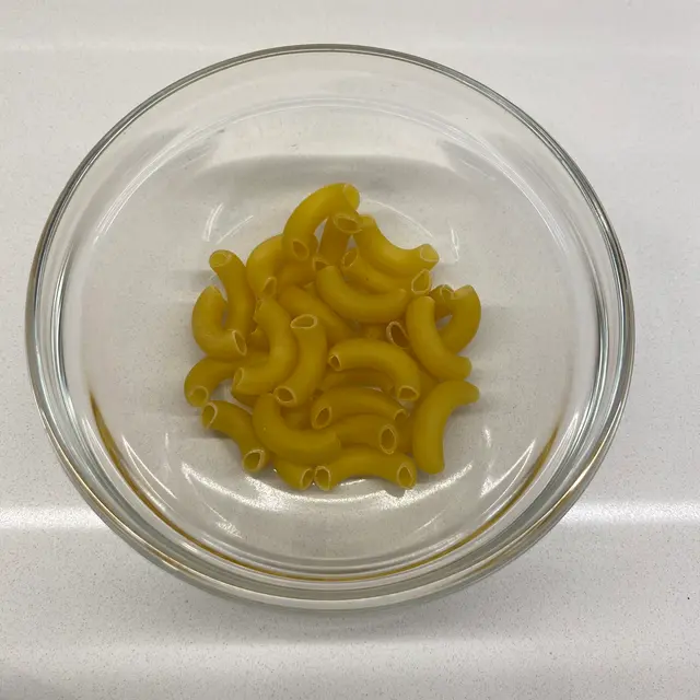 Large Elbow Macaroni in a clear round glass bowl