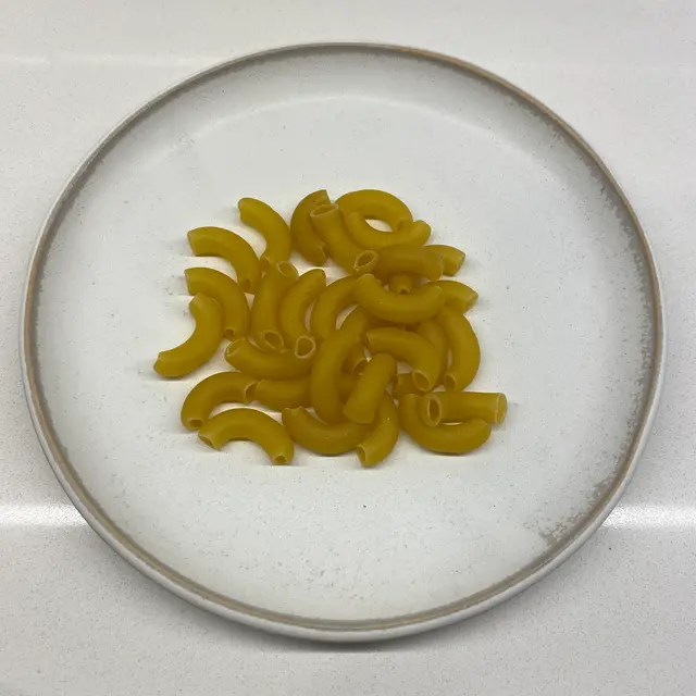 Large Elbow Macaroni on a round white plate