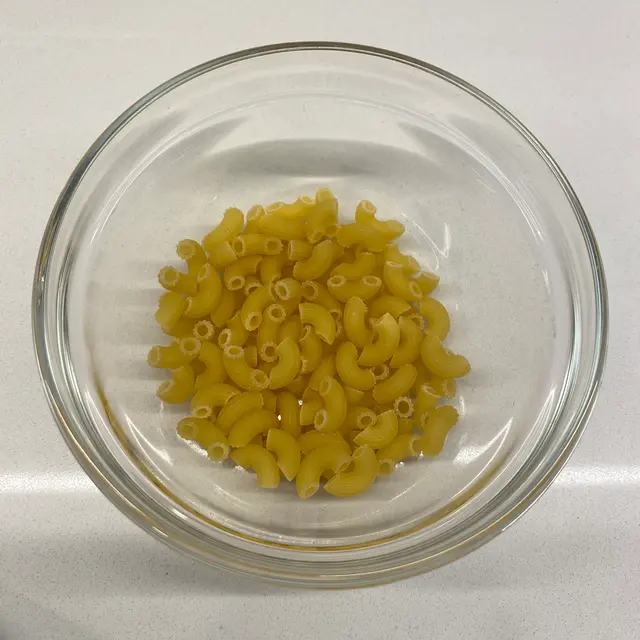 Small Elbow Macaroni in a clear round glass bowl