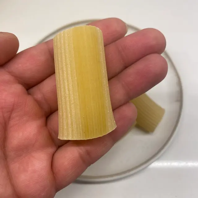 Paccheri in a hand