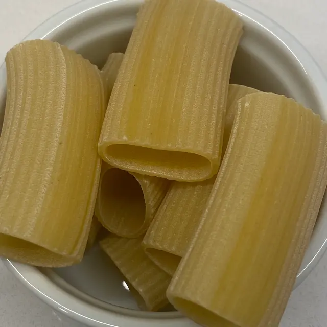 A close up shot of Paccheri in a round white ramekin