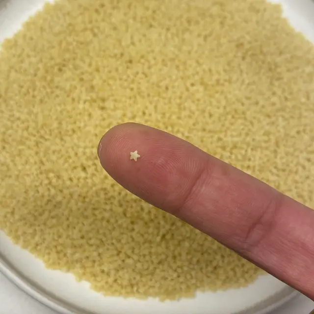 Pastina held between fingers