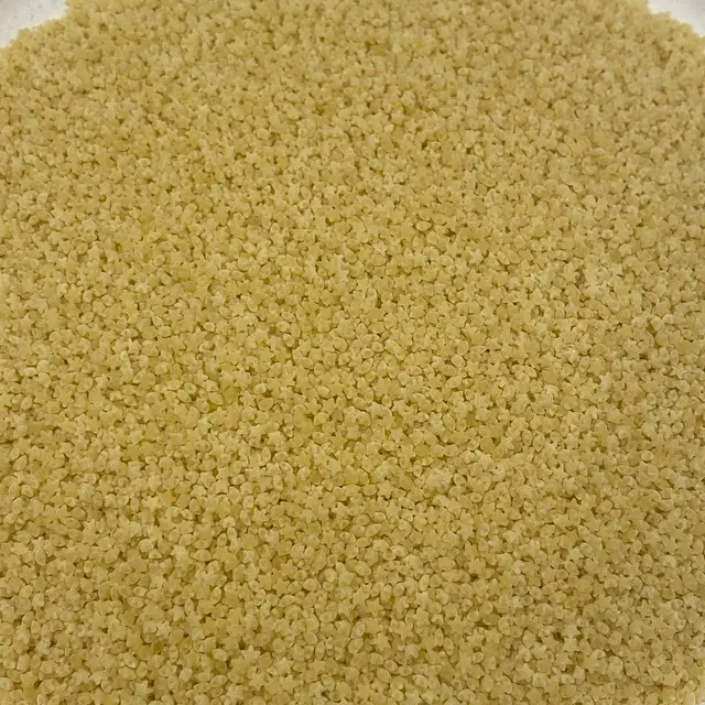 A close up shot of Pastina on a round white plate