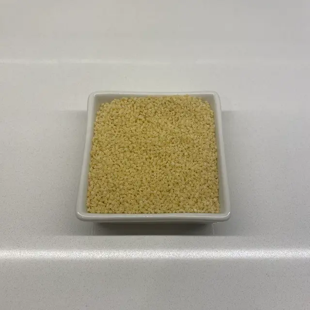 Pastina in a square white glass bowl