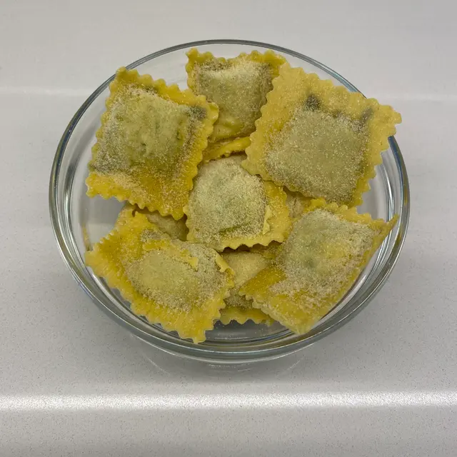 Ravioli in a clear round glass bowl