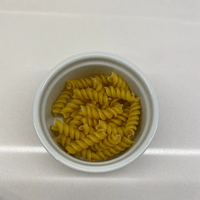 Rotini in a round white ramekin