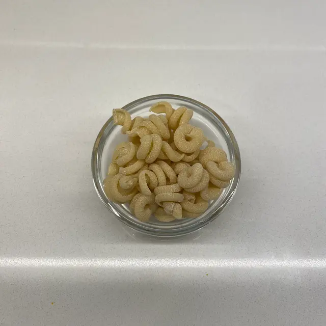 Trottole in a small round white glass bowl