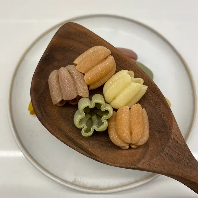 Zucchiette in a wooden serving spoon