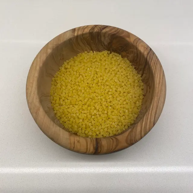 Acini di pepe in a round wooden bowl