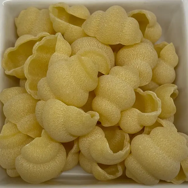 A close up shot of Cestini in a square white glass bowl