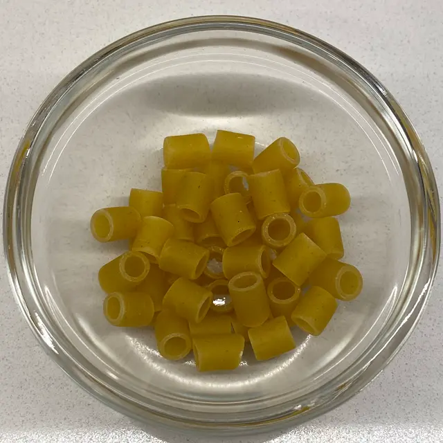 A close up shot of Ditalini in a small round white glass bowl
