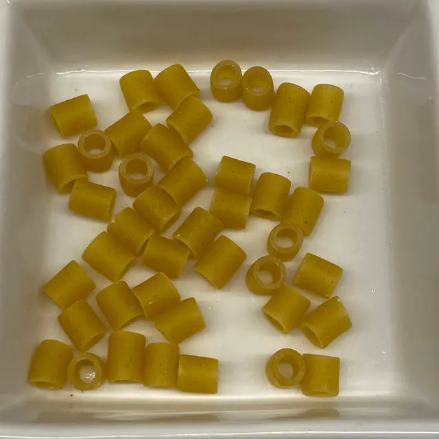 A close up shot of Ditalini in a square white glass bowl