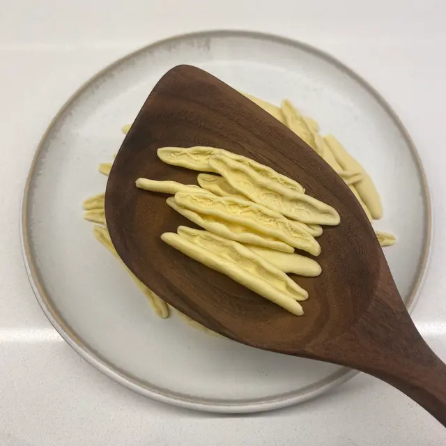 Foglie d’ulivo in a wooden serving spoon