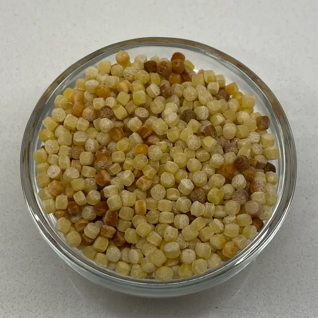 A close up shot of Fregola in a small round white glass bowl