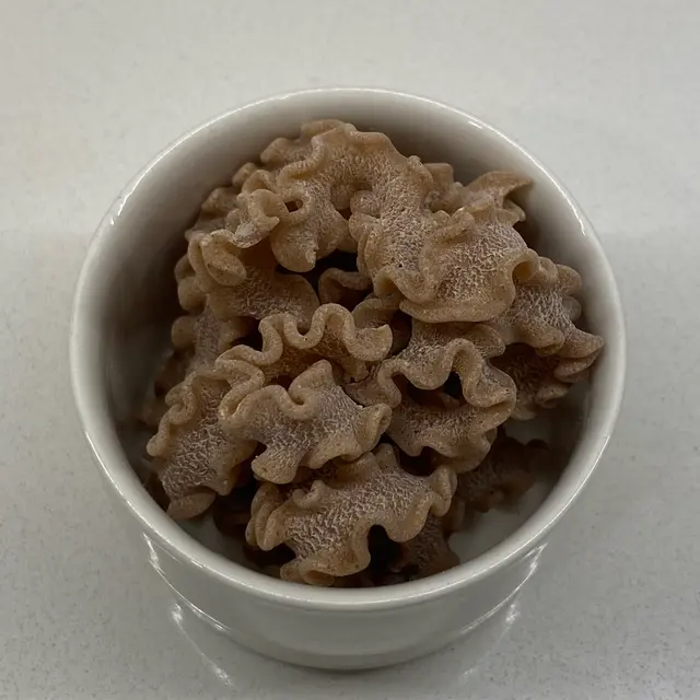 A close up shot of Scarabocchio in a small white bowl