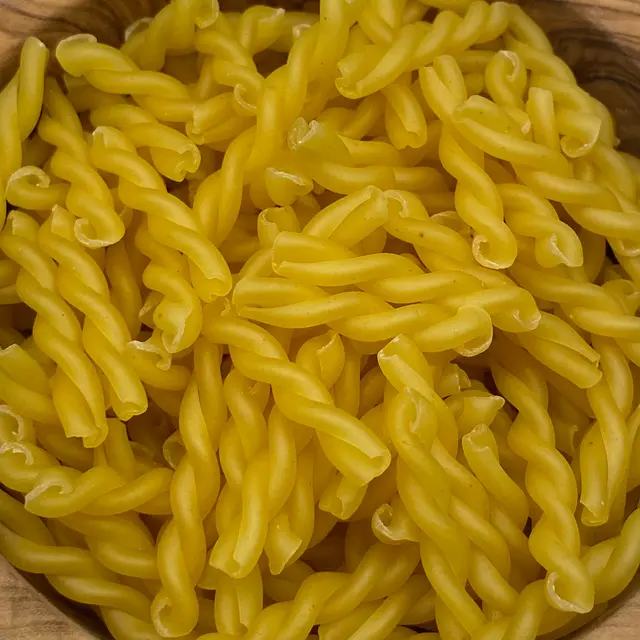 A close up shot of Treccine in a round wooden bowl