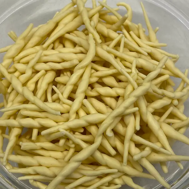 A close up shot of Trofie in a clear round glass bowl