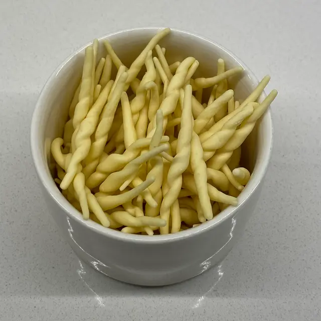 A close up shot of Trofie in a small white bowl
