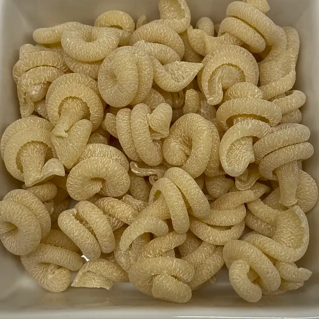 A close up shot of Trottole in a square white glass bowl