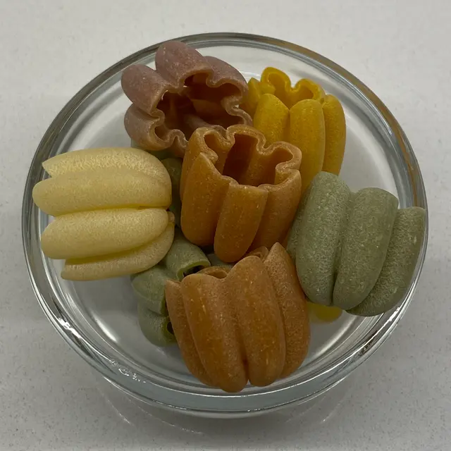 A close up shot of Zucchiette in a small round white glass bowl