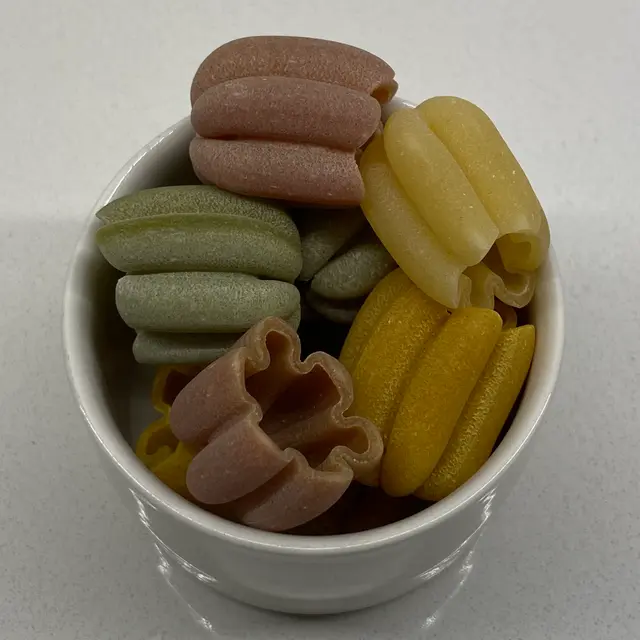 A close up shot of Zucchiette in a small white bowl